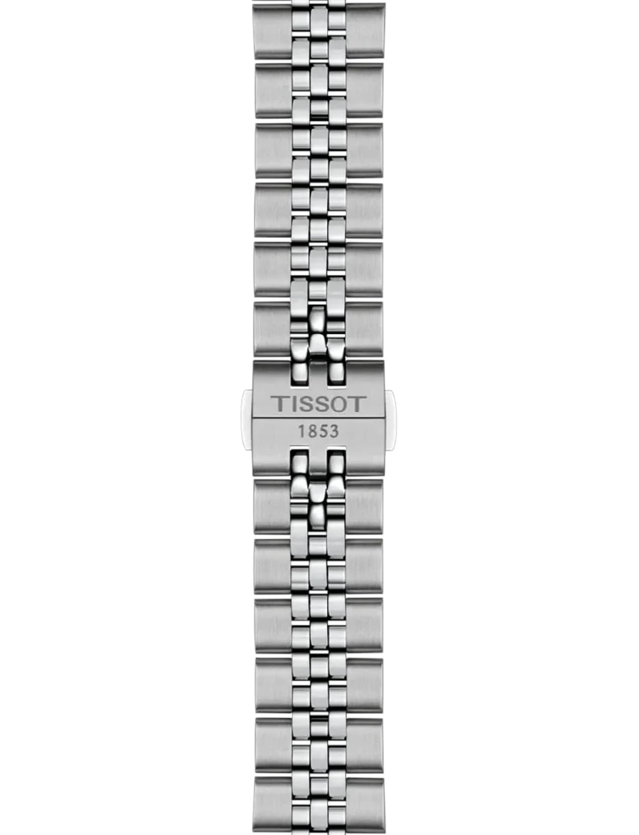 Close-up of a stainless steel Tissot watch bracelet with a clasp engraved 'TISSOT 1853'.