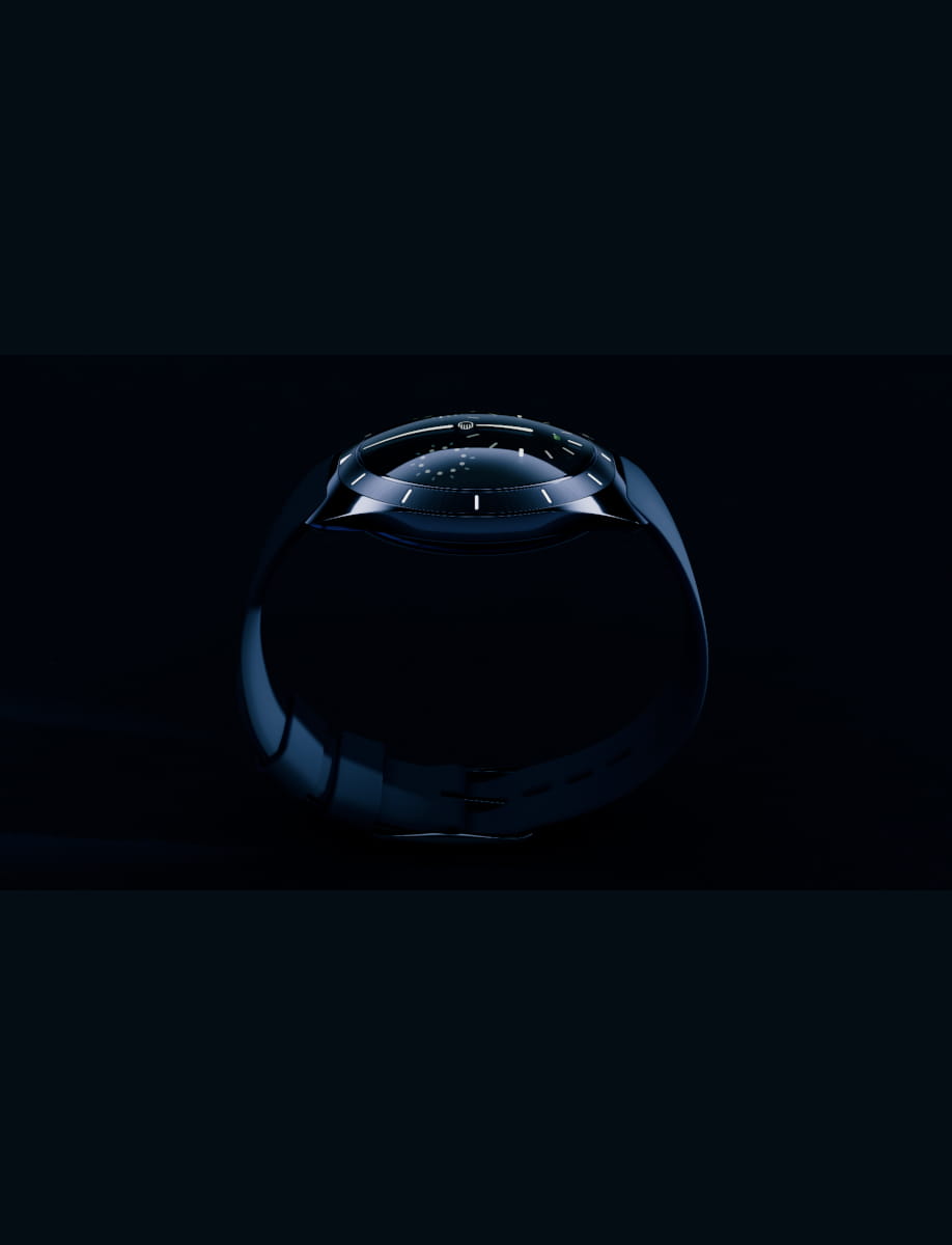 Close-up of a dark round wristwatch on a black background.
