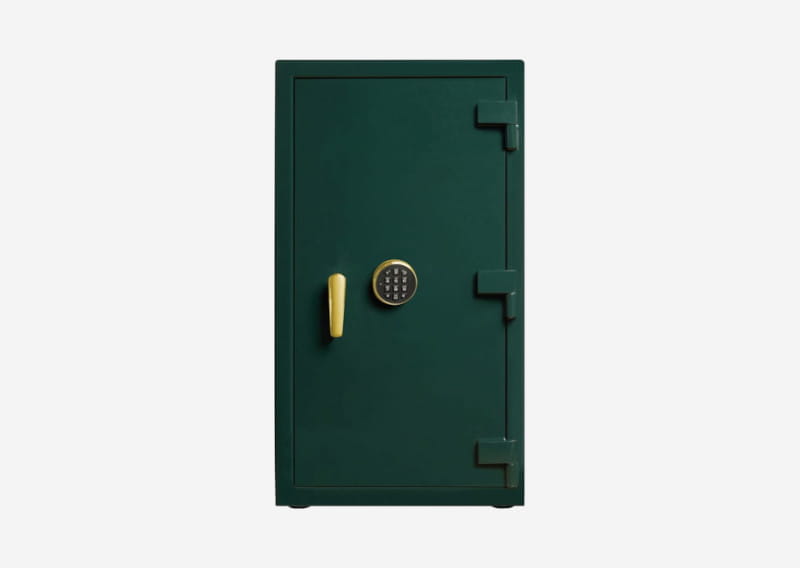 Green metal safe with a yellow handle and circular keypad on a plain background.